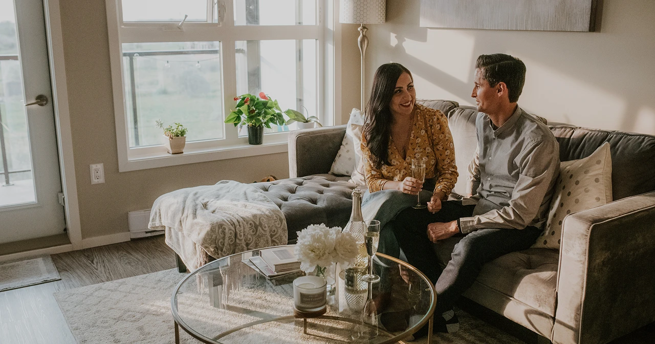couple talking sitting on sofa